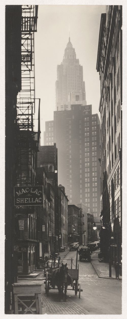 Intersection of Cliff and Ferry Streets, Woolworth Building in background, New York City, New York