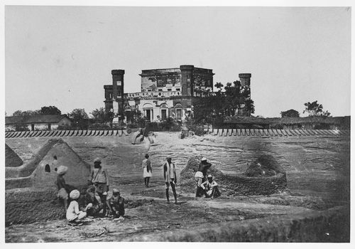 Distant view of the Khurshid Manzil [House of the Sun Palace] (now part of La Martinière College) showing fortifications in the foreground, Lucknow, India