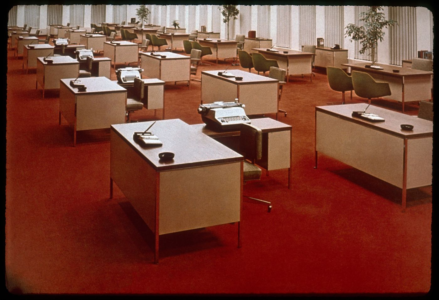 Open plan office interior on red carpet, precedent for the Bank of Canada interior design