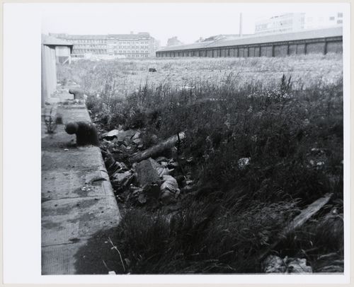 View of open field in an industrial area in Glasgow, Scotland