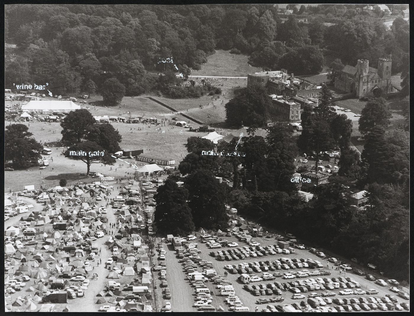 Aerial view of the Elephant Fayre festival in Port Eliot, England, showing wine bar, pool, main gate, office and main theatre
