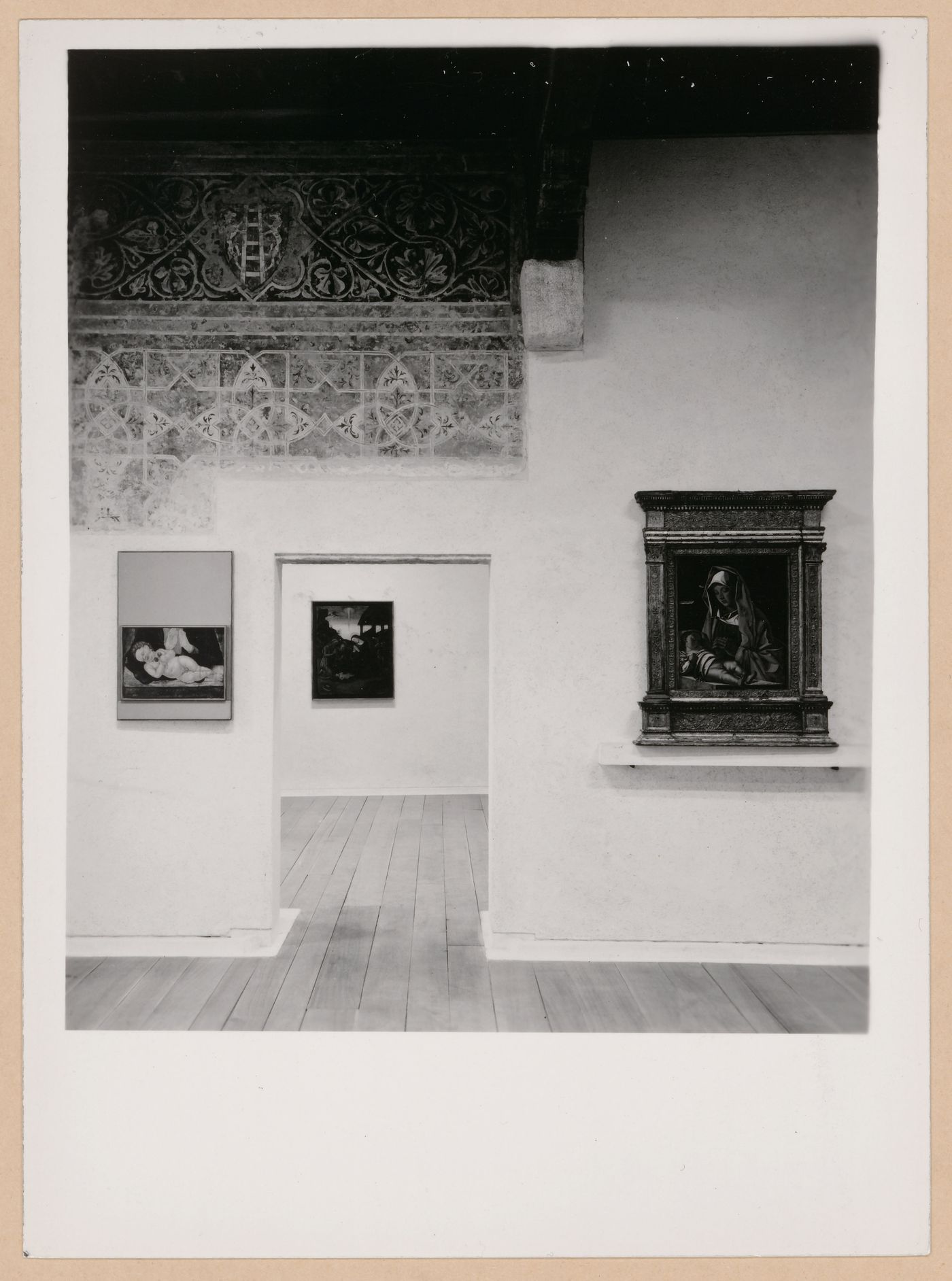 Interior view of a gallery showing paintings, a fresco, a doorway and another gallery, Museo di Castelvecchio, Verona, Italy