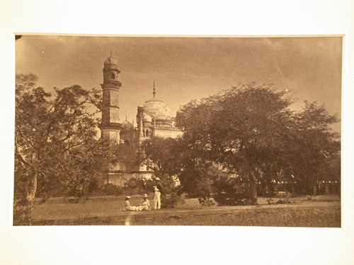 Partial view of the Bibi-ka Maqbara (also known as the tomb of Rabia Daurani) with trees and people in the foreground, Aurangabad, India
