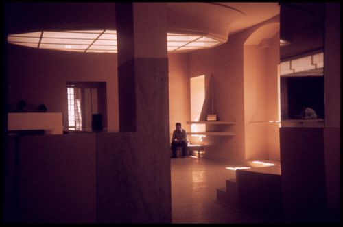 View of man and interior of Banco Pinto & Sotto Mayor, agência e clube, Lamego, Portugal