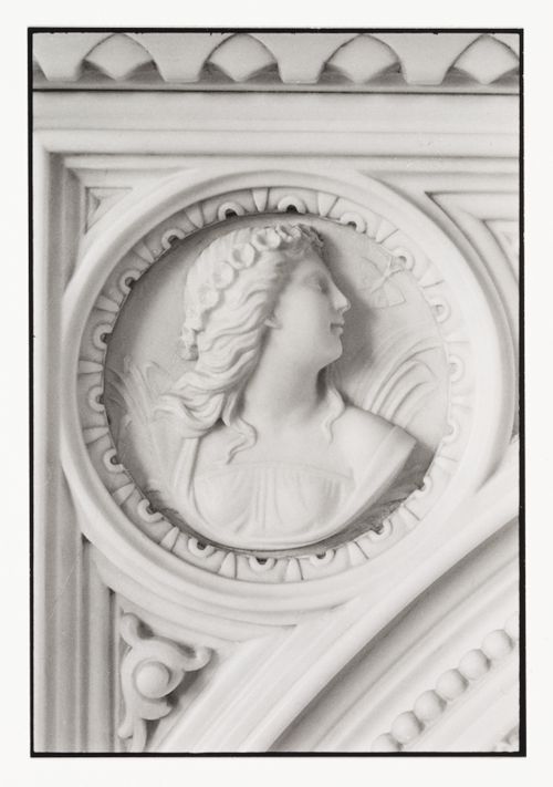 Close-up view of the fireplace mantel bas-relief in a front room in the west part of Shaughnessy House, Montréal, Québec, Canada