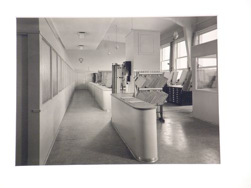 Interior, view of architectural ? office with drawing boards, drawing cabinets, and frosted glass interior windows