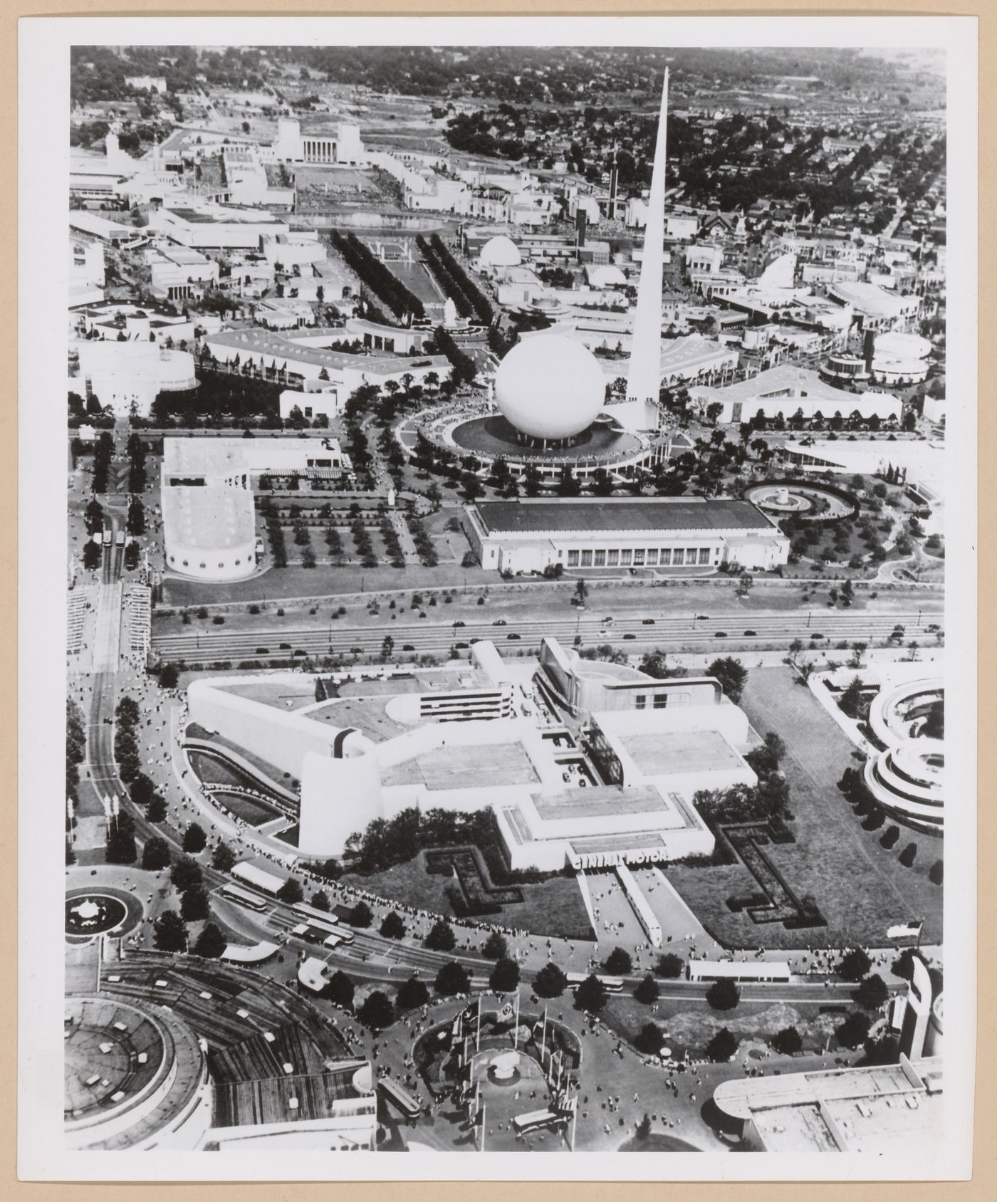 Aerial view of the General Motors Corporation pavilion showing the Trilon and Perisphere in the background, 1939-1940 New York World's Fair, New York City, New York