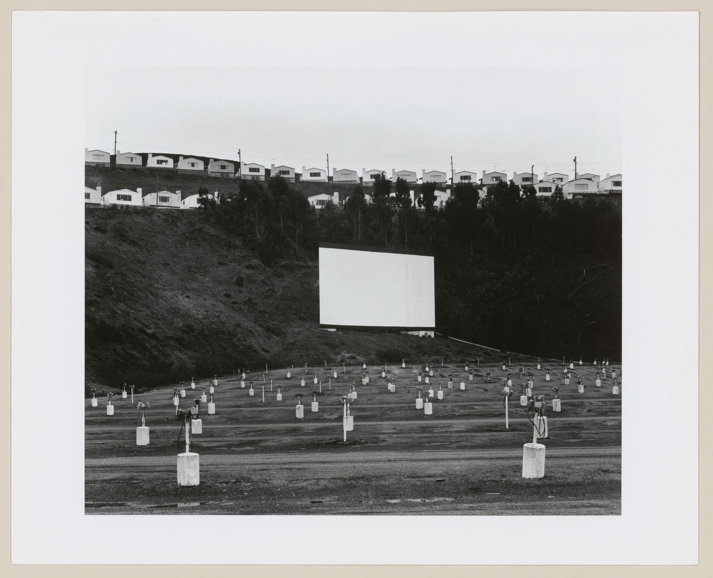 View of a drive-in theater and fabricated homes, United States, from the series "A Trip West"