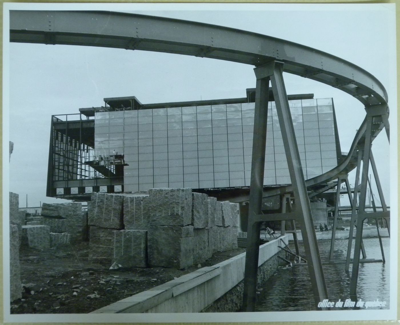 View of the Province of Quebec Pavilion at its construction stage with the minirail as foreground, Expo 67, Montréal, Québec
