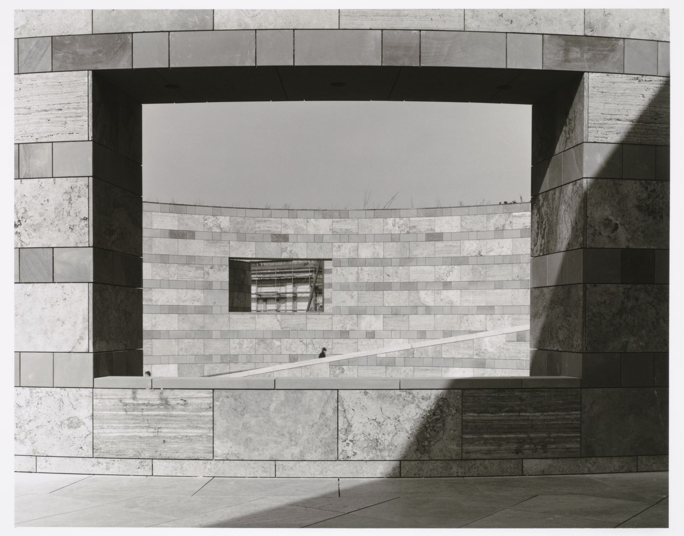 Partial view of the ramp through an opening with scaffolds in the background, Neue Staatsgalerie [New National Gallery], Stuttgart, Germany