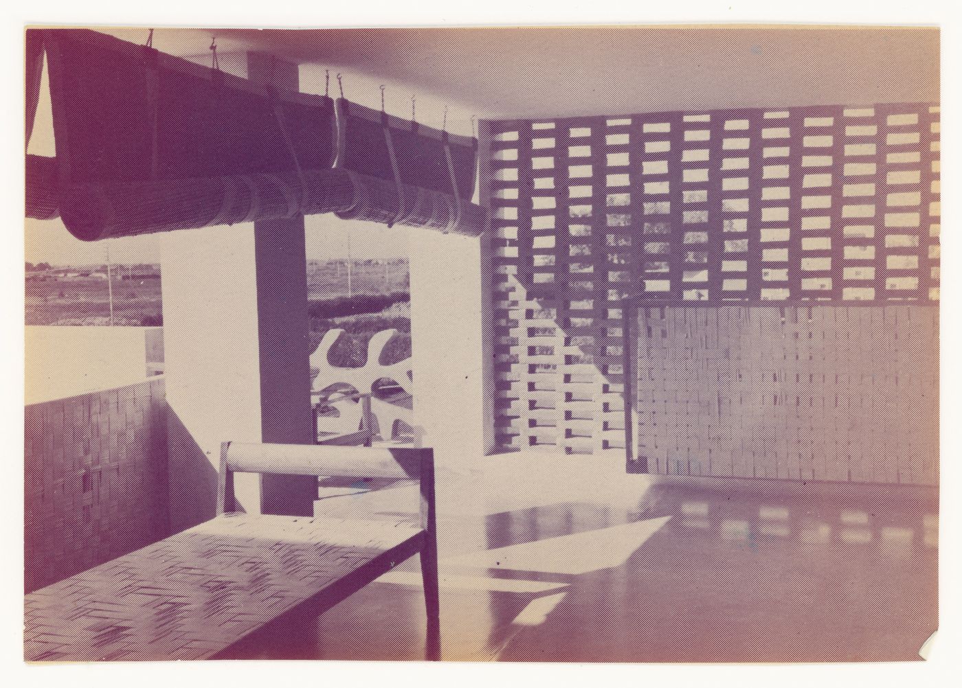 View of a modernized traditional bed and straw blinds in a loggia, Chandigarh, India