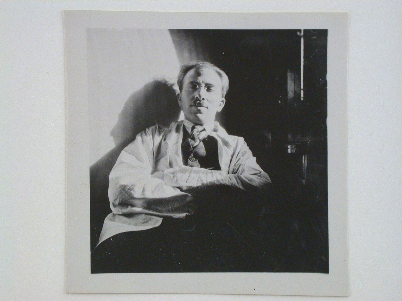 Portrait of André Bloc, editor of L'Architecture d'aujourd'hui, in a train car