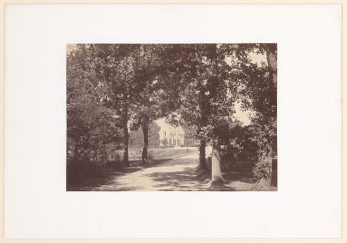 Distant view of unidentified gate house, one trees and road in foreground, Bois de Boulogne, Paris, France