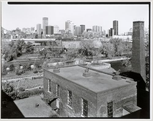 View of Lachine Canal and the Caledonian Ironworks Building looking north from the roof of the Belding Corticelli Spinning Mill with downtown Montréal in the background, Québec