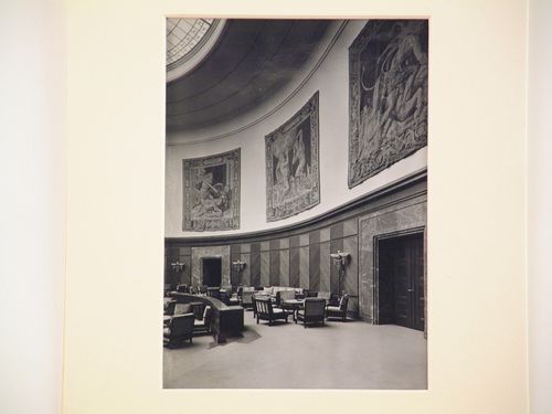 Interior of large round room, with tapestries