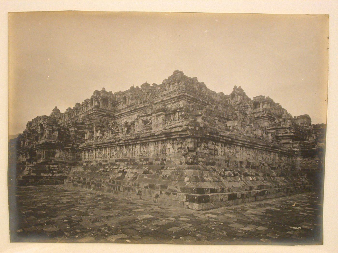 View of the temple of Borobudur taken from a corner of one of the lower levels and looking up, showing relief panels and sculpture, Borobudur, Indonesia