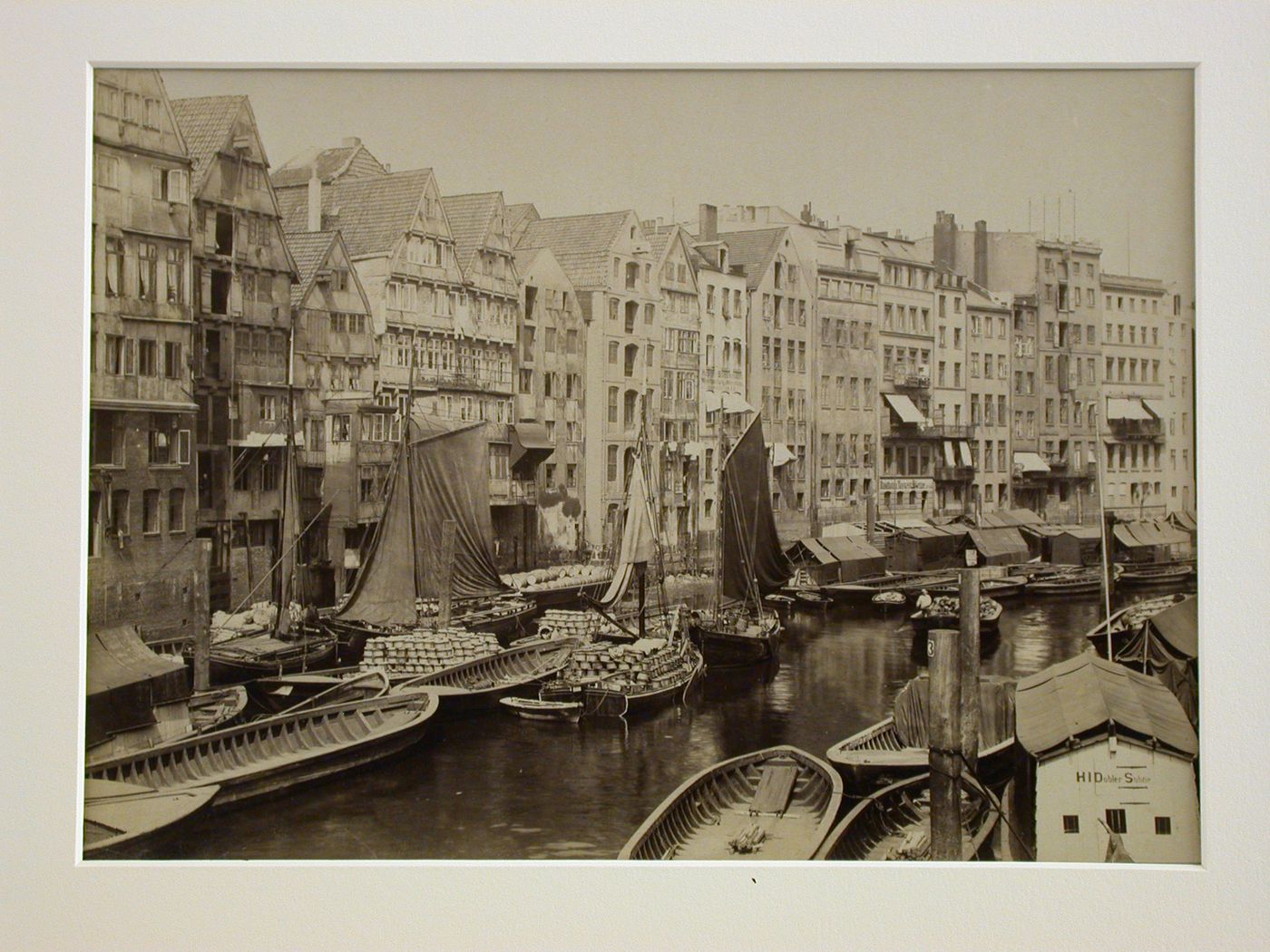 View of a narrow canal, crowded with boats, with houses on one side, Hamburg, Germany