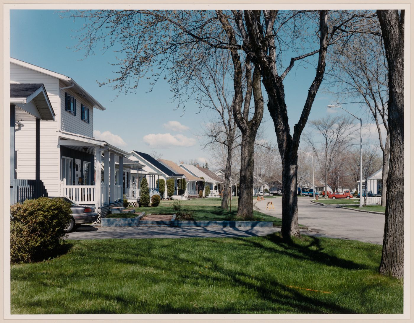 Section 1 of 2 of Panorama of workers' housing built by Wartime Housing Limited, 1941-46 rue Lamarche at rue Poitras looking northwest, Arvida, Quebec