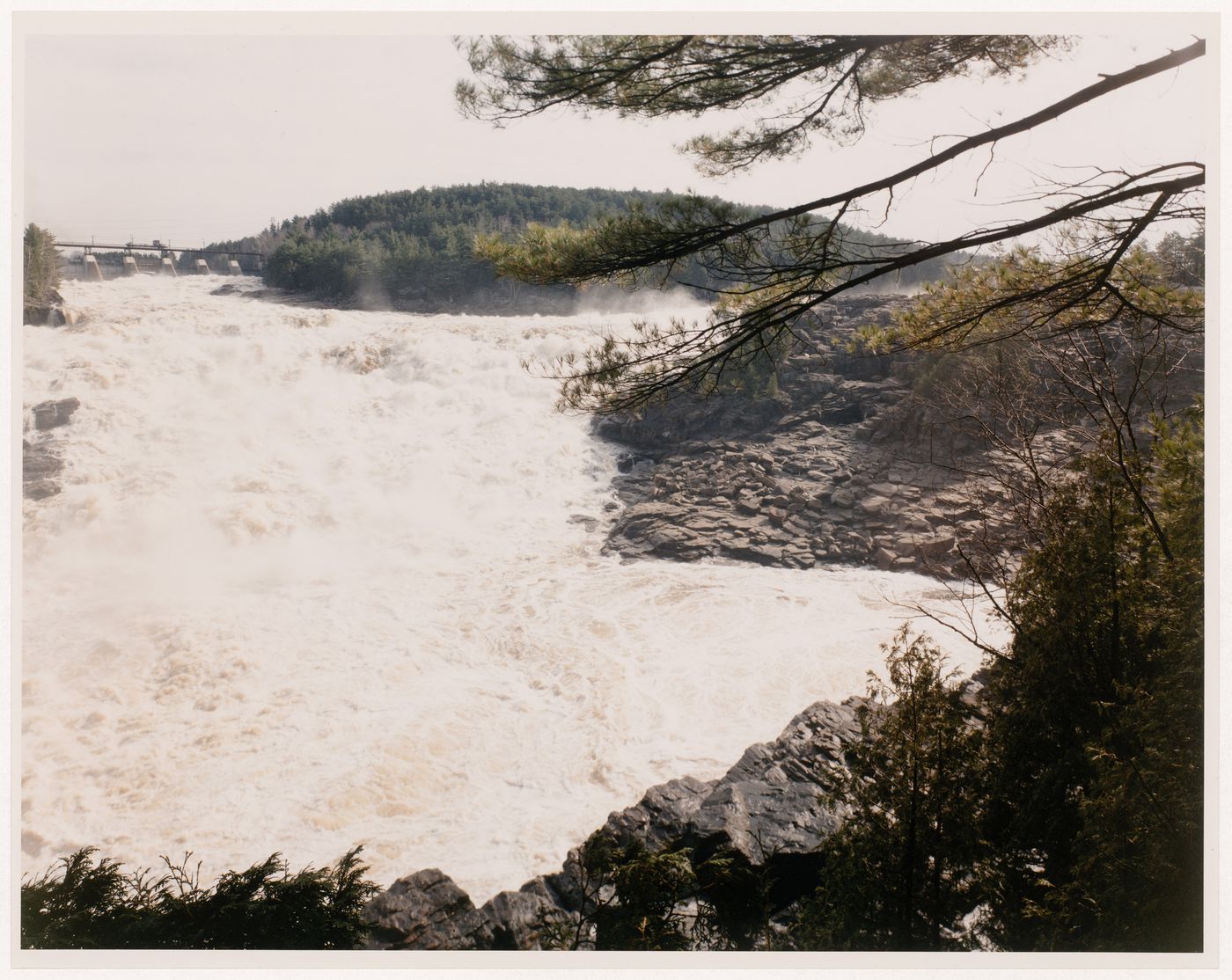 Section 2 of 2 of Panorama of Shawinigan Falls, looking north, showing gorge, Shawinigan 3 power station, Canadian Pacific bridge, spillway, and Melville Island