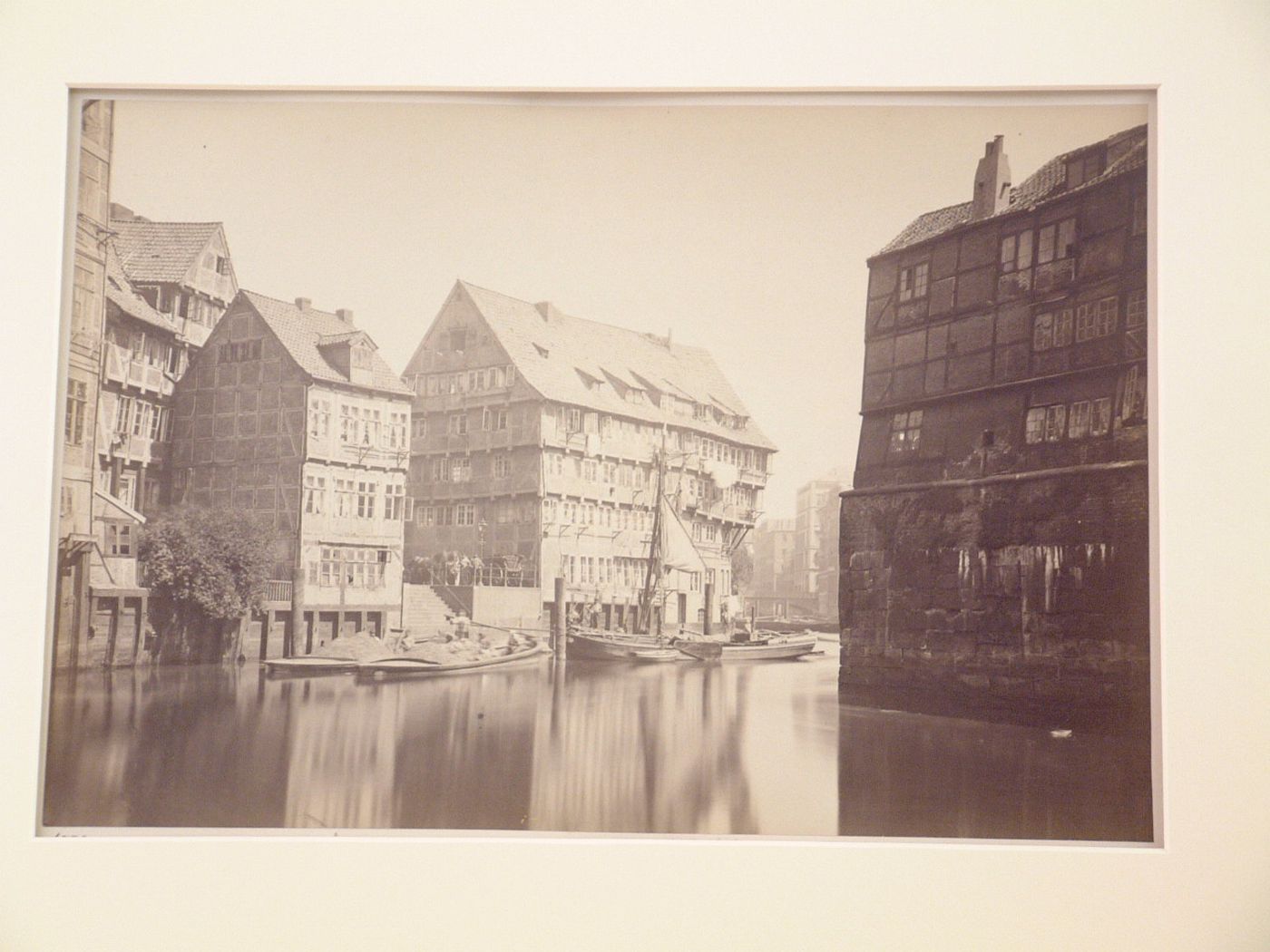 Canal through residential area with boats and barges, Hamburg, Germany