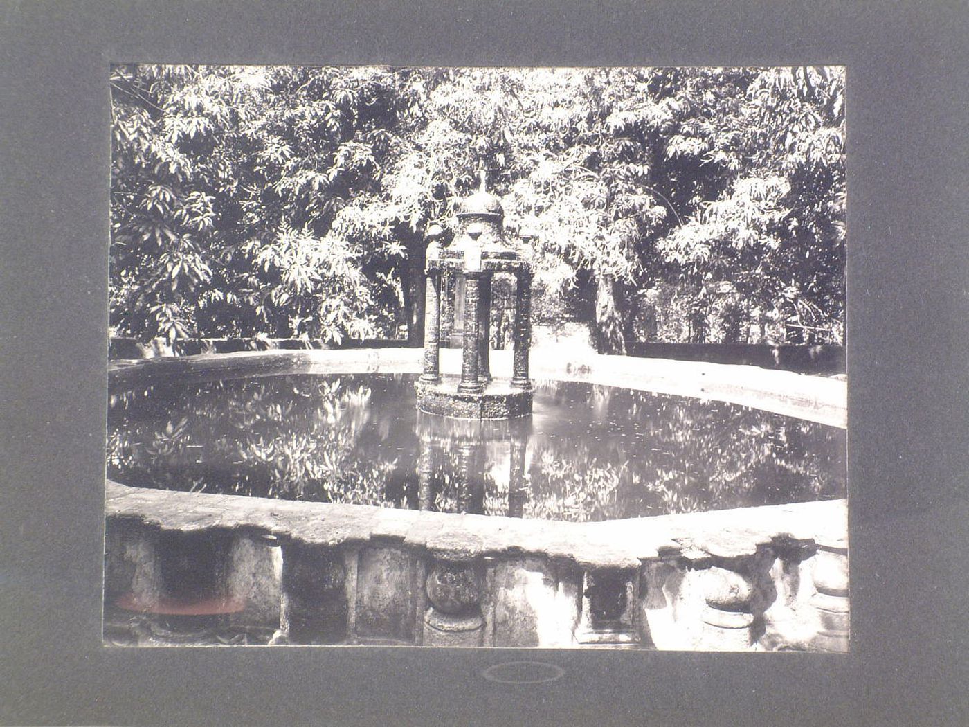 Partial view of a fountain in the Jardín Borda with trees in the background, Cuernavaca, Mexico