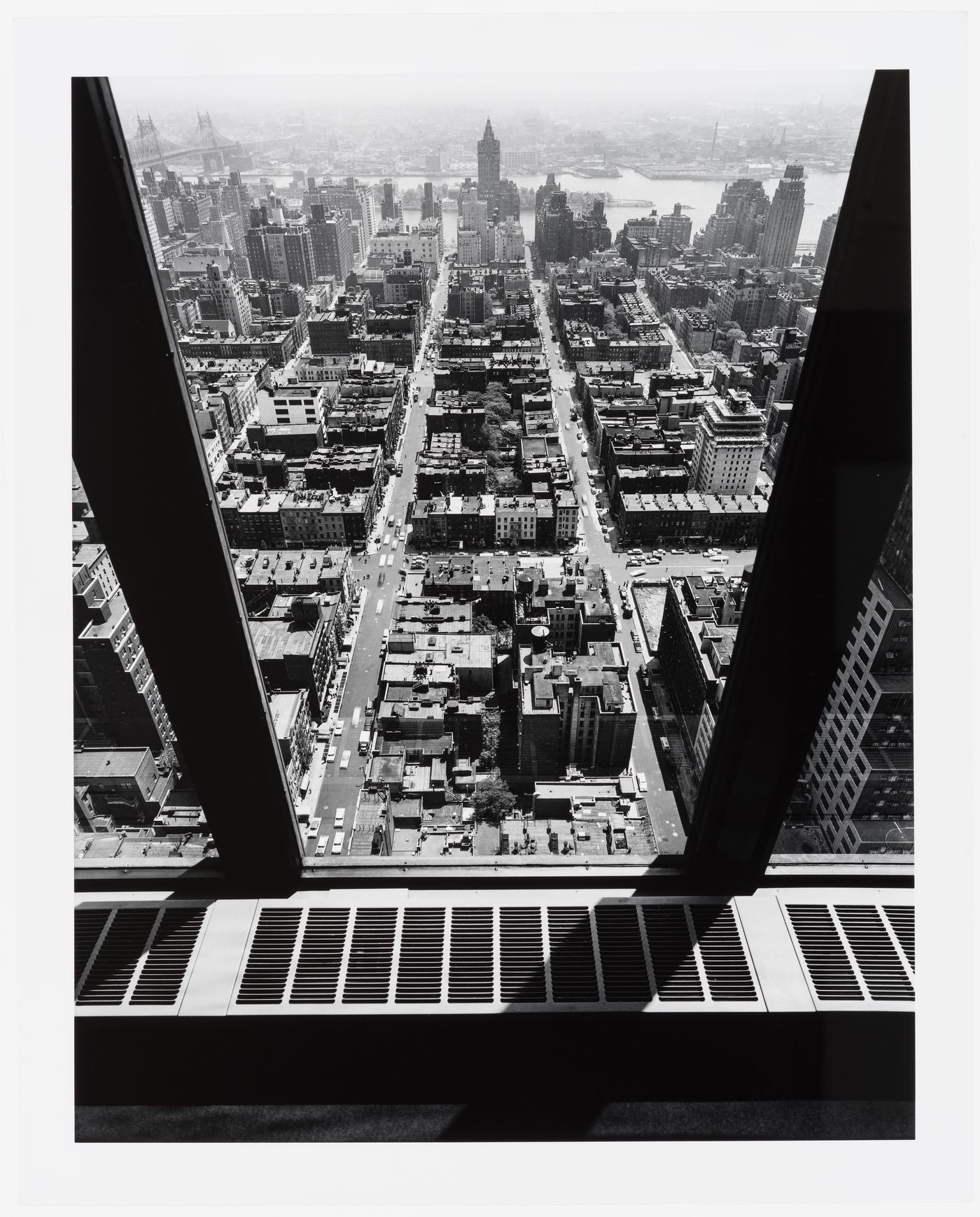 View from the top floor of the Seagram Building showing the surrounding buildings and the East River, New York City