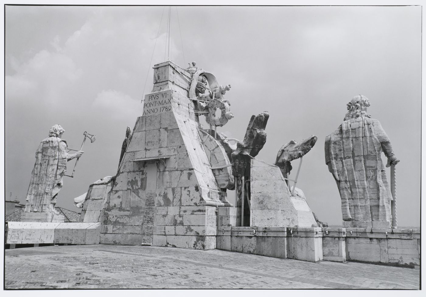 Roof of St. Peter's, view from behind of statues and building date, Rome, Italy