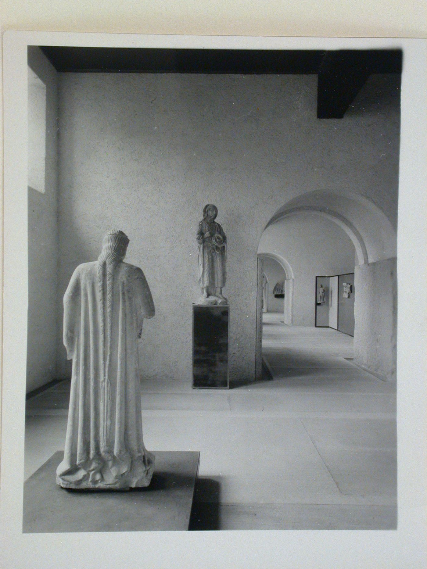 Interior view of a gallery showing statues with doorways and other galleries in the right background, Museo di Castelvecchio, Verona, Italy