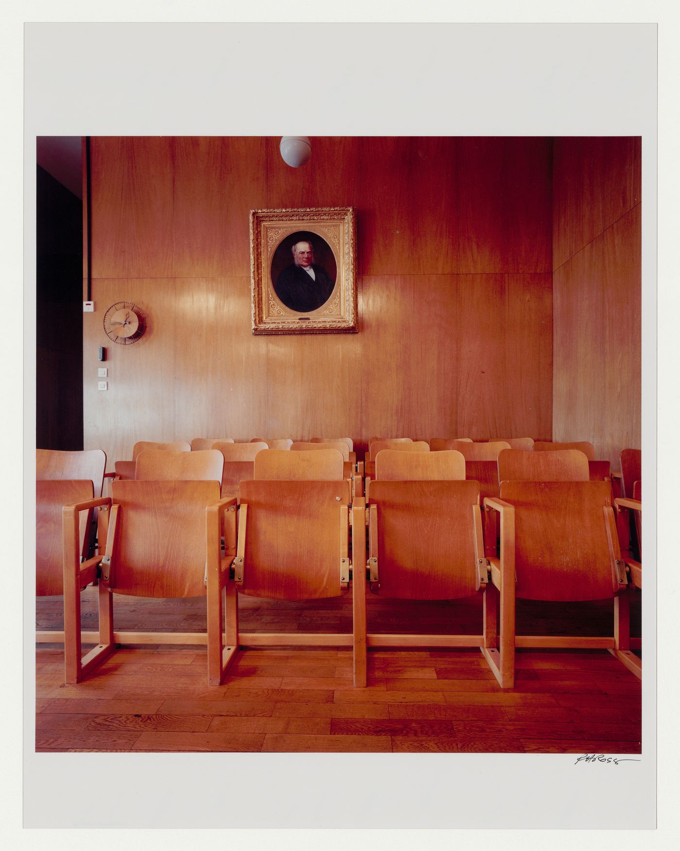 Interior view of the courtroom  with chairs in the foreground and a framed portrait painting hanging in the background, Göteborgs rådhusets tillbyggnad [courthouse annex], Göteborg, Sweden