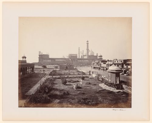 View of the Jami Masjid from the south showing commercial buildings on the right and a garden in the foreground, Delhi, India