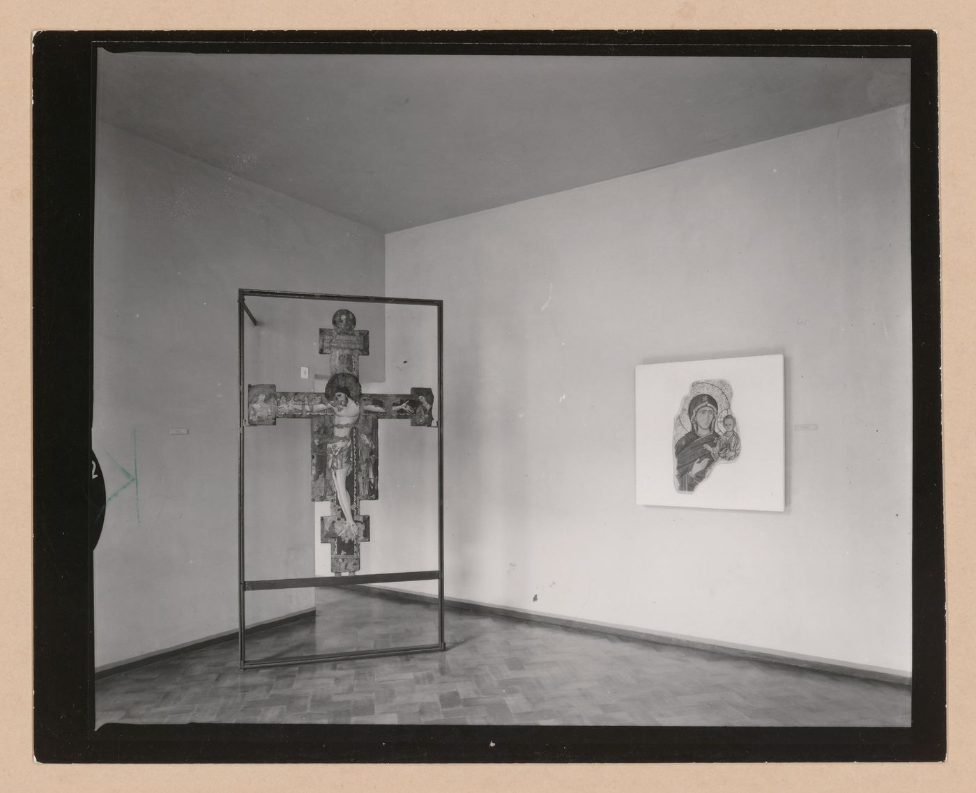 Interior view of the Sala della croce giunteesca showing a painted crucifix mounted on a metal easel and a painting, Palazzo Abatellis, Galleria regionale della Sicilia, Palermo, Italy