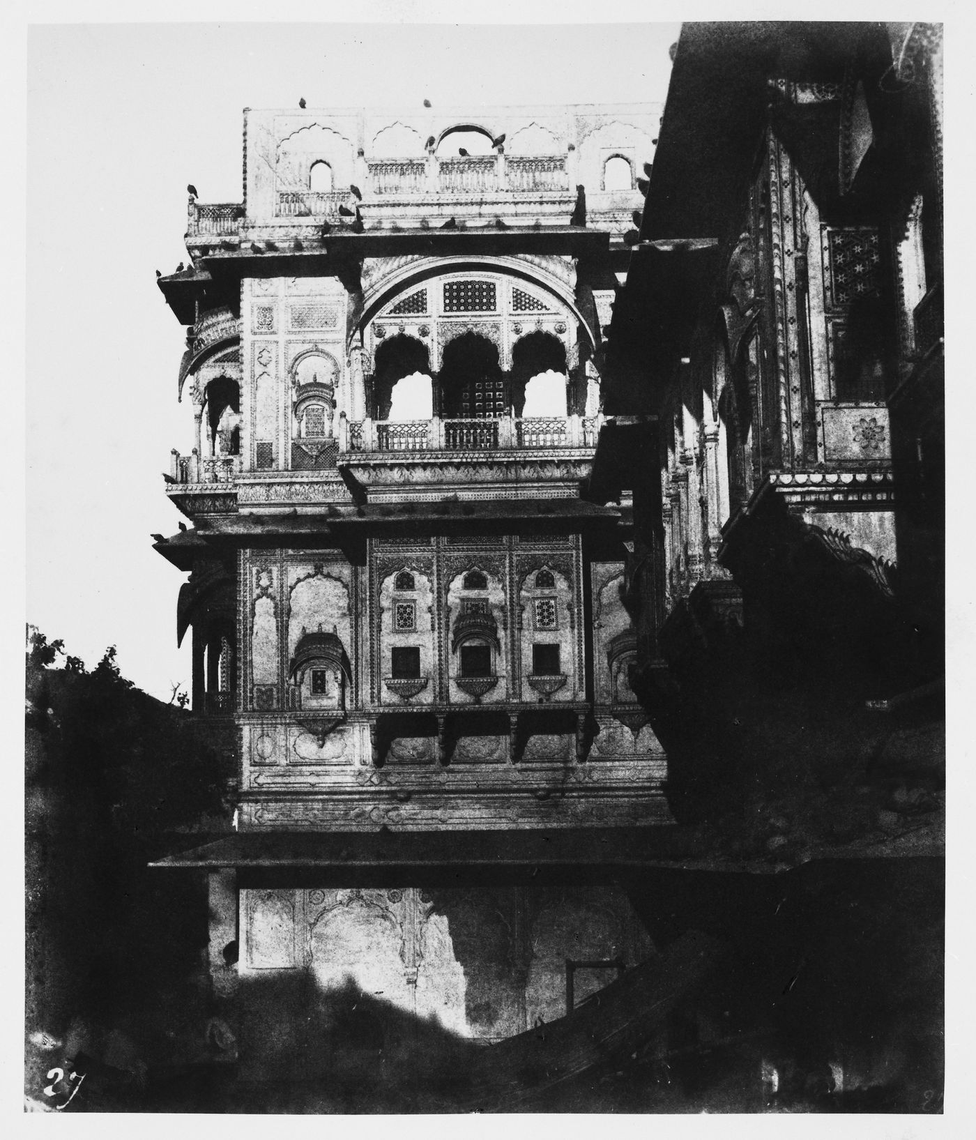 Partial view of a haveli showing an ornate façcade with a balcony and windows, Ajmere (now Ajmer), India