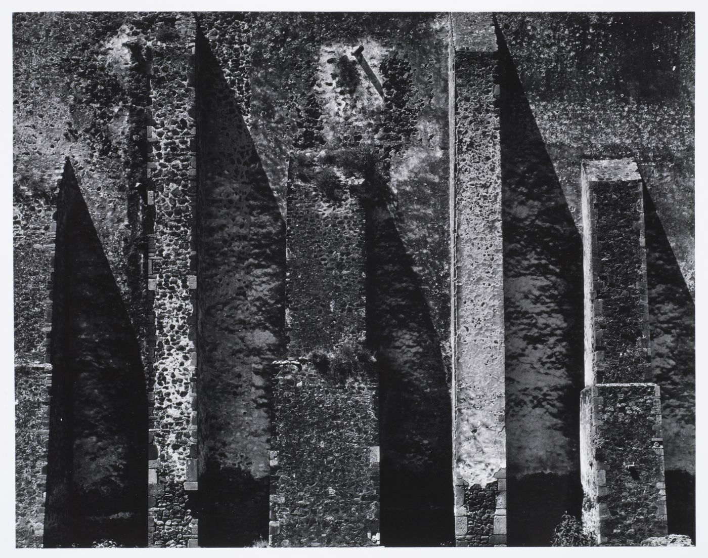 Close-up view of buttresses on a stone wall, possibly the Monastery of San Augustin, Alcoman, Mexico