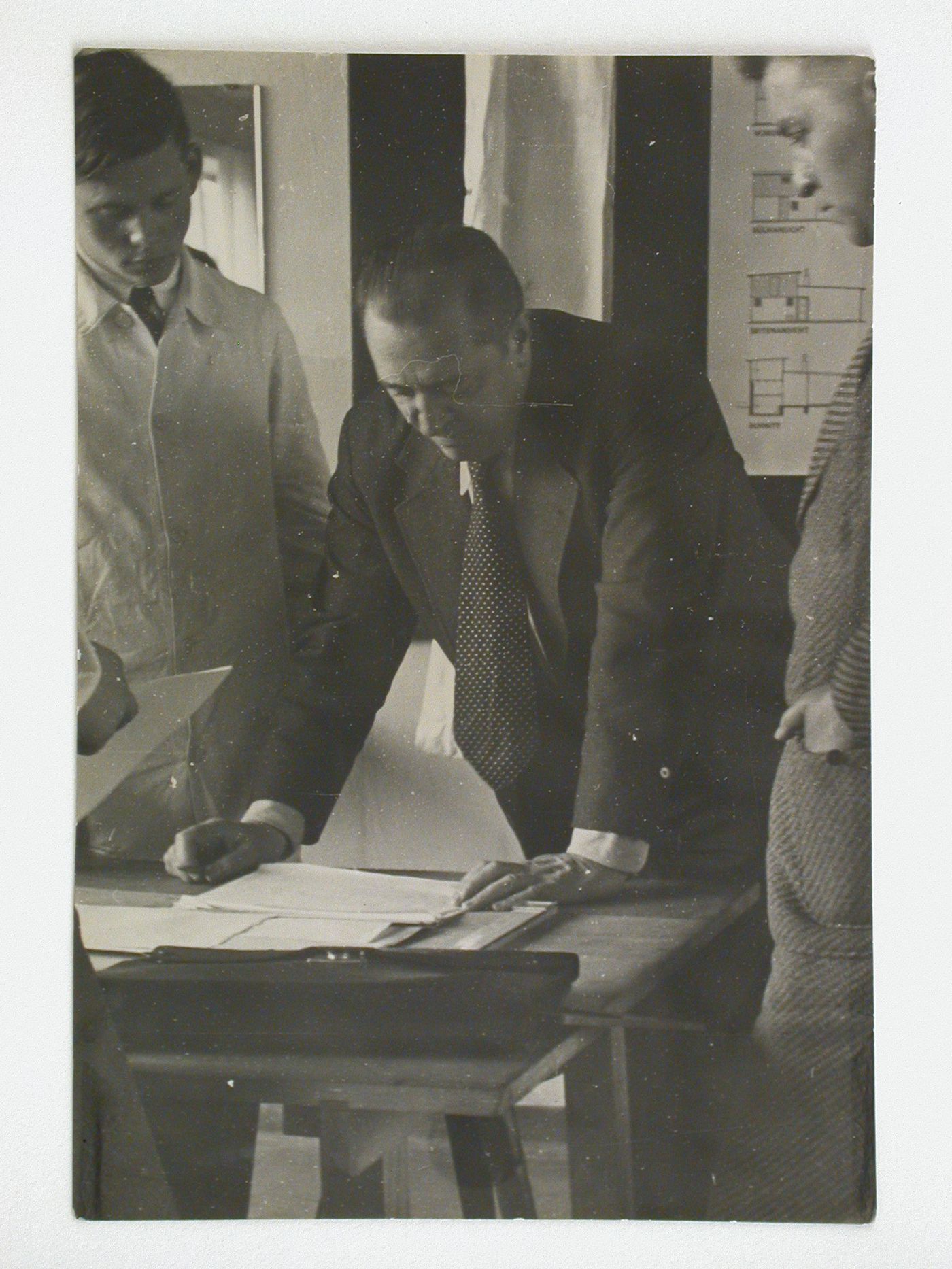 Mies van der Rohe conducting a seminar at the Bauhaus with students Heinrich Neuy and Herman Klumpp, Dessau, Germany