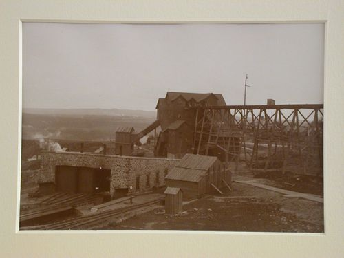 View of track, brick car housing, wooden mine shafts and scaffolding