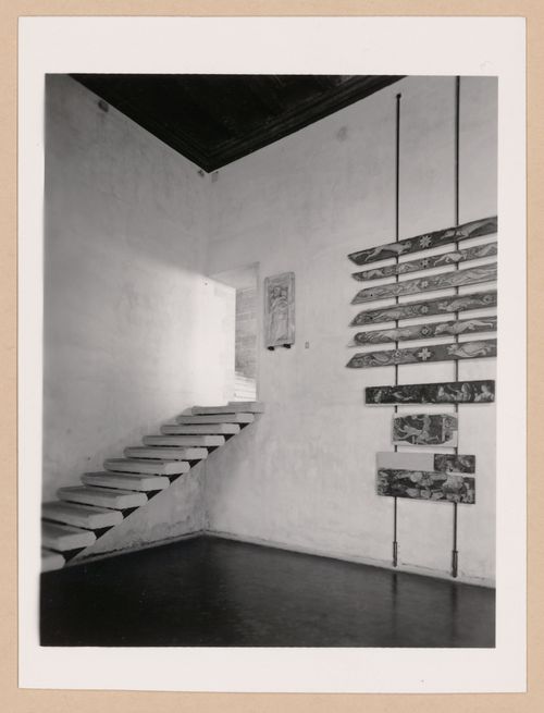 Interior view of Sala VI showing a staircase, paintings and a relief, Palazzo Abatellis, Galleria regionale della Sicilia, Palermo, Italy