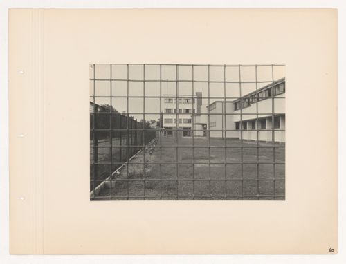 View of the main entrance and employees' building of the Budge Foundation Old People's Home through a chain link fence, Frankfurt am Main, Germany