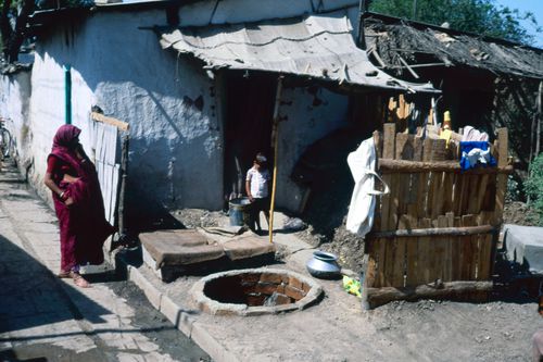 View of a house and inhabitants in India