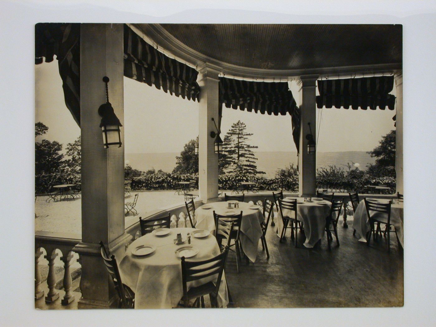 Interior view of the porch of the Longue Vue Golf Course clubhouse looking out towards the terrace, New York [?], United States