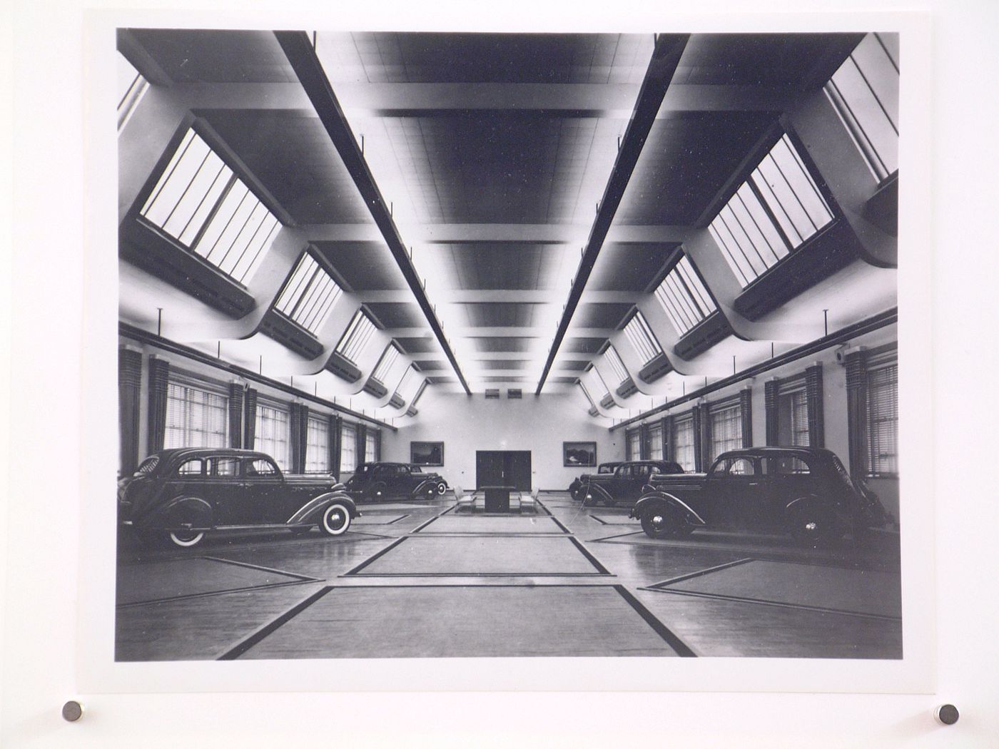 Interior view of automobiles on display in a showroom of the Engineering Building (formerly the Personnel Building), Chrysler Corporation Highland Park Plant, Highland Park, Michigan