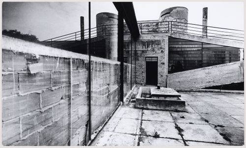 View of the first floor terrace of Villa Savoye showing a temporary [?] brick wall constructed inside the living room windows, possibly during World War II, Poissy, France