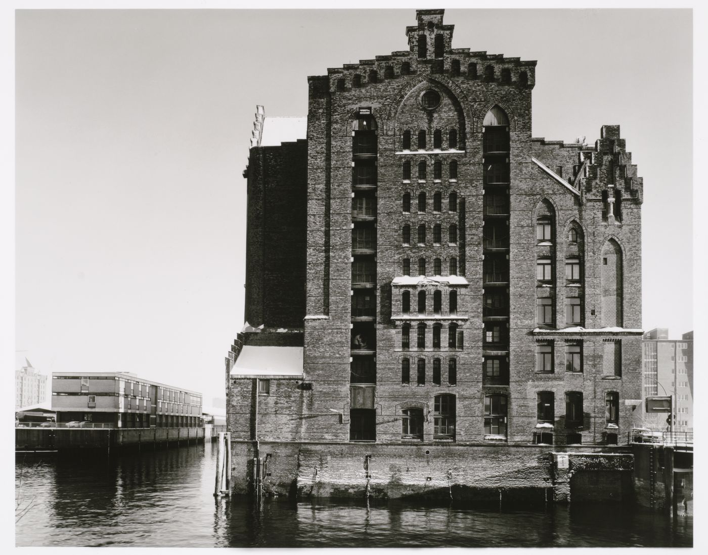 View of a Speicherblock [Storage Block] of Speicherstadt [Storage City] warehouses from across a canal, Megdeburger Strasse, Altstadt, Hamburg, Germany