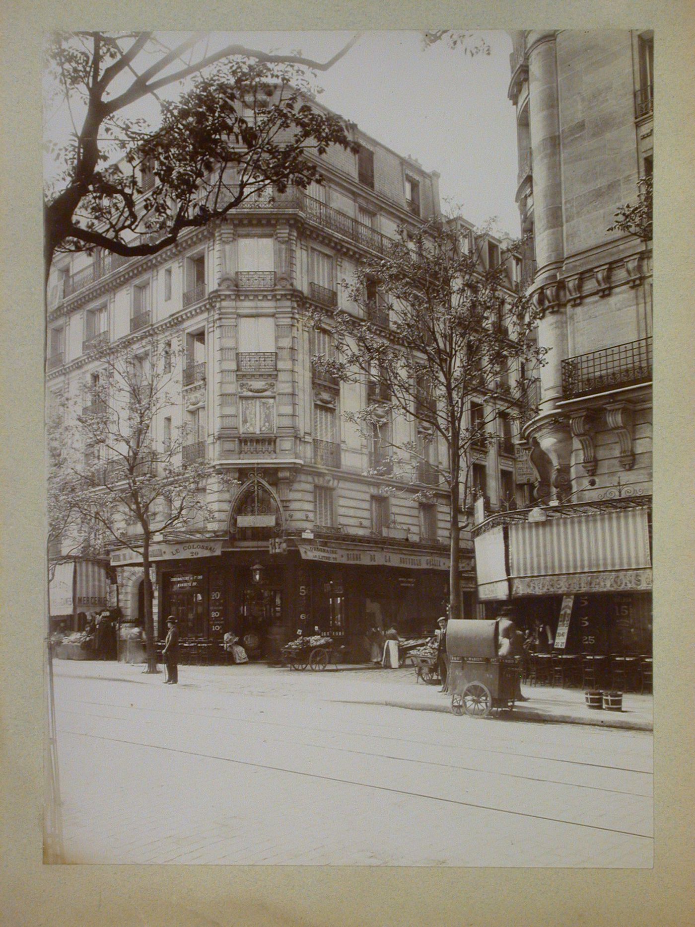 View of cafés, a store and apartment houses, 28 rue Secrétan at Impasse Monferrat, Paris, France