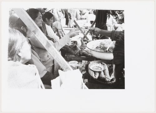 People and food in a market, South America