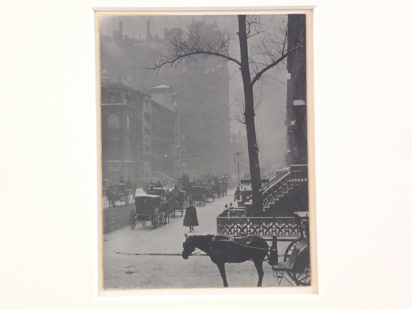 30th Street, and Fifth Avenue [?] view of street corner with carriages in snow, New York City, New York