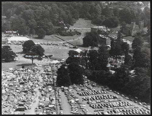 Aerial view of the Elephant Fayre festival in Port Eliot, England, showing wine bar, pool, main gate, office and main theatre