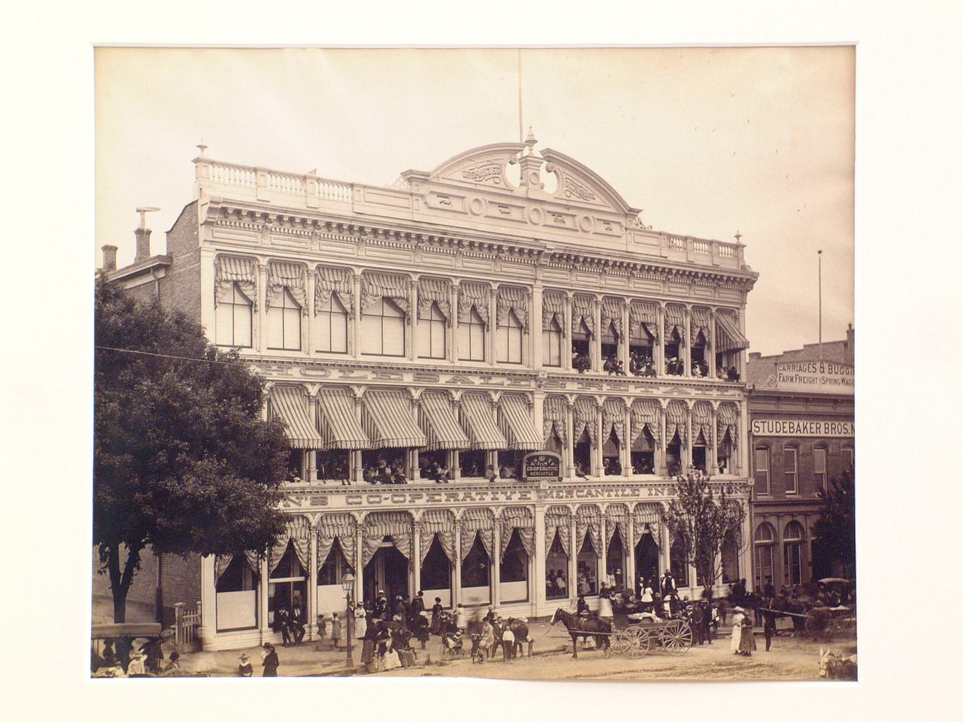 Front exterior view of Zion Cooperative Mercantile one Building with people at windows, on street, Salt Lake City, Utah