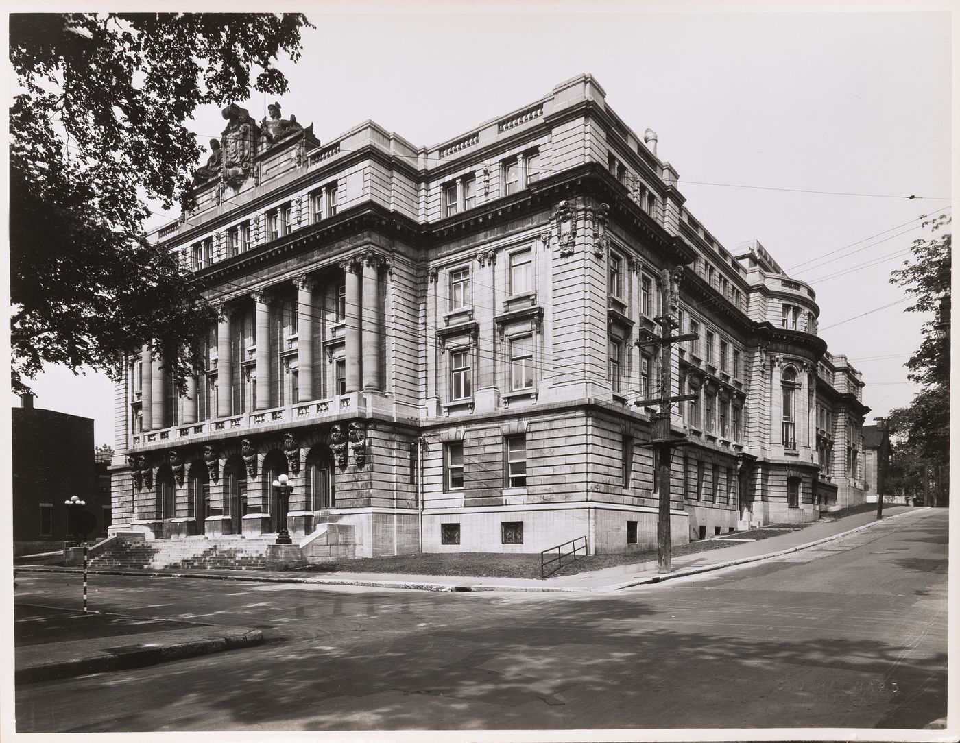 View of the principal and lateral façades of École des hautes études commerciales (now the Centre d'archives de Montréal), 535 avenue Viger Est, Montréal, Québec
