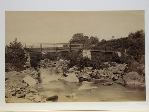 Wooden bridge over small stream, England ?