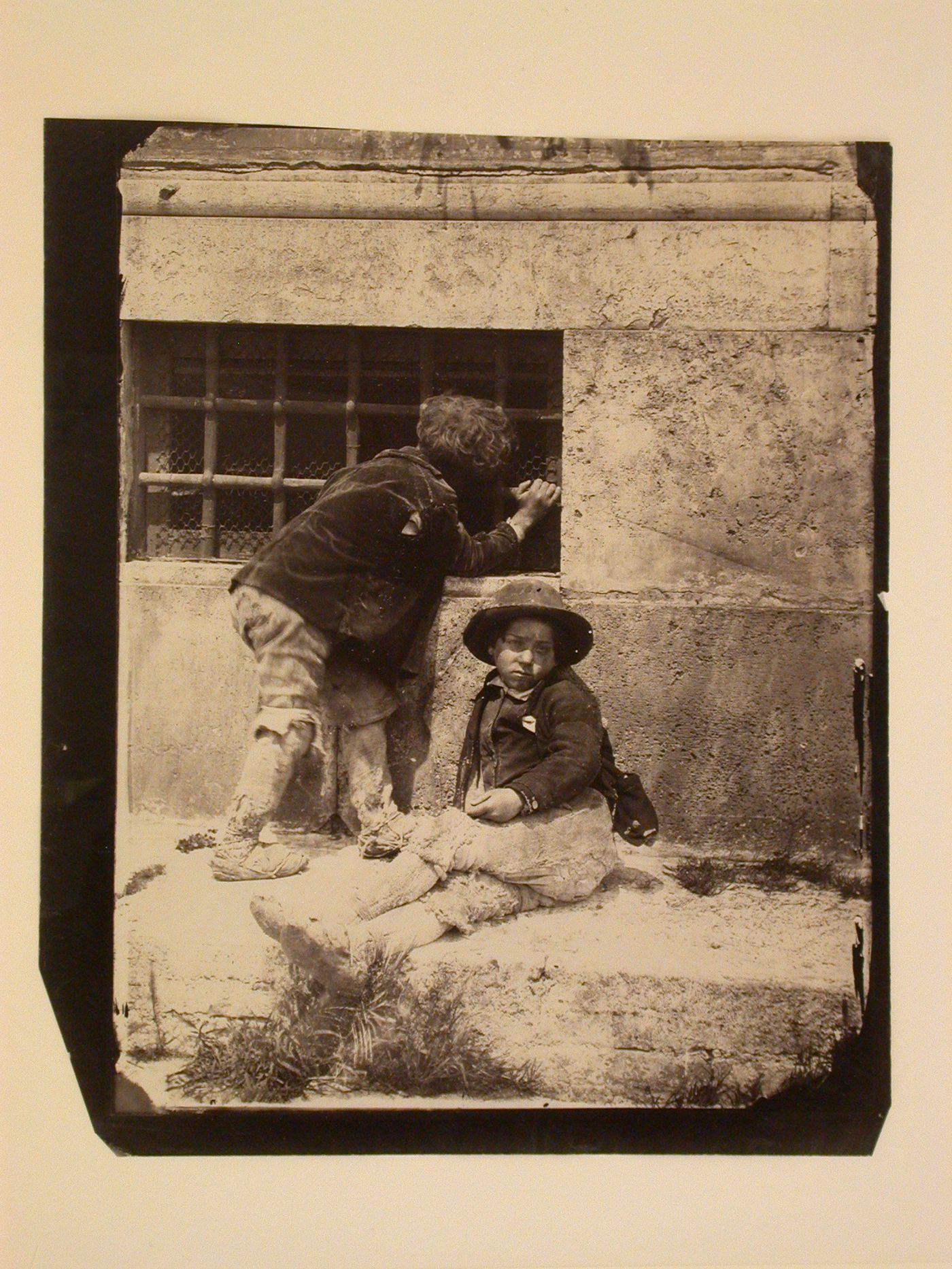 Base of building with two children, Italy